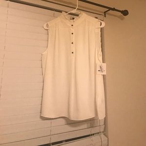 White shell with ruffled neck