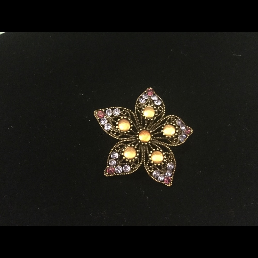 Purple and gold brooch