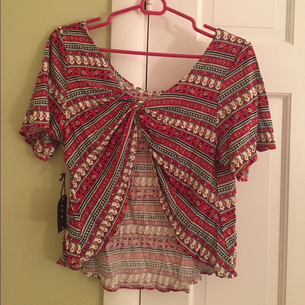 KNIT TOP WITH OPEN BACK.  NEVER WORN!