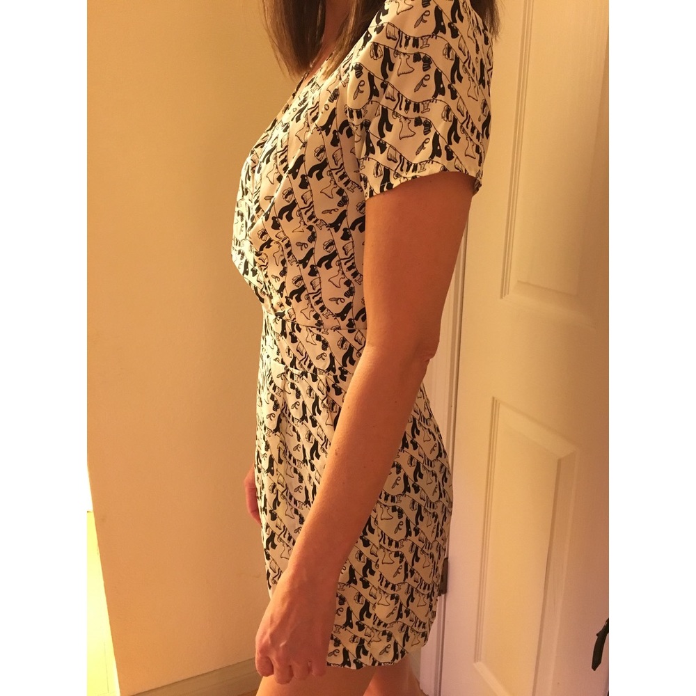 Modcloth Romper with little clotheslines on it