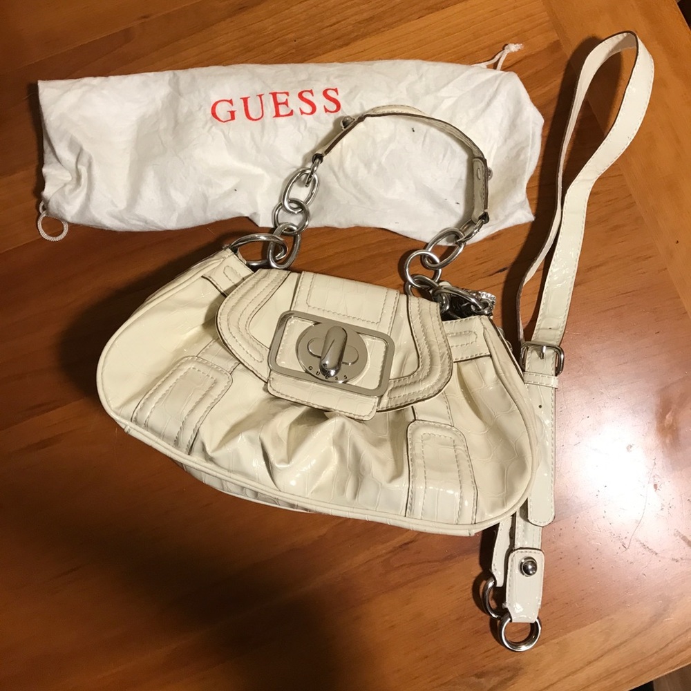 Cream pleather chain bag.