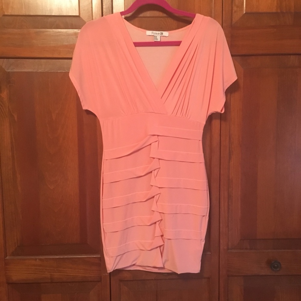 Coral Peach Form fitting cling dress.
