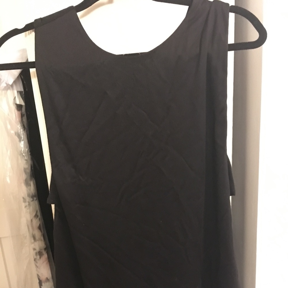 Banana tunic black top with cutouts. NWT