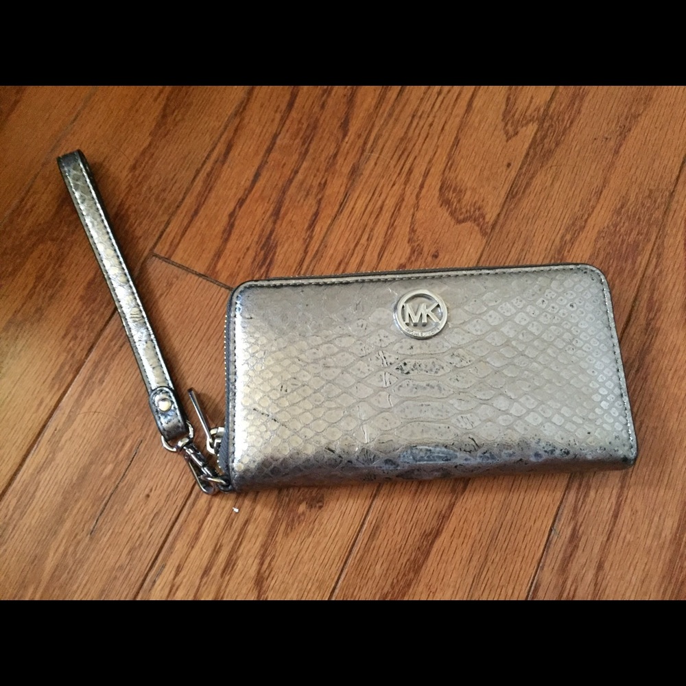 Michael Kors silver wristlet/wallet :)