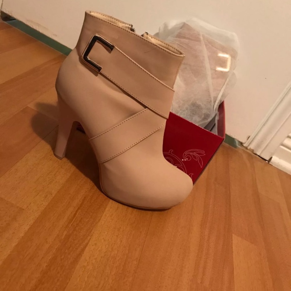 Nude booties with gold buckle