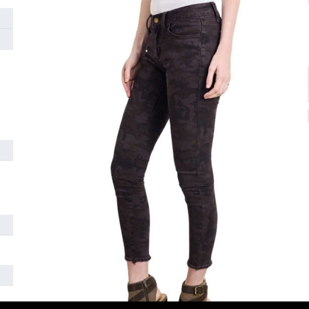 Distressed denim jeans