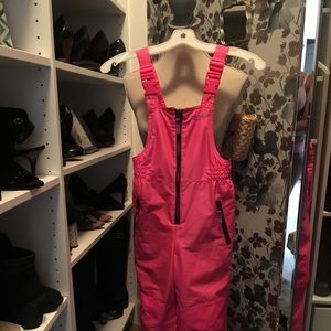 Girls pink Champion ski suit.
