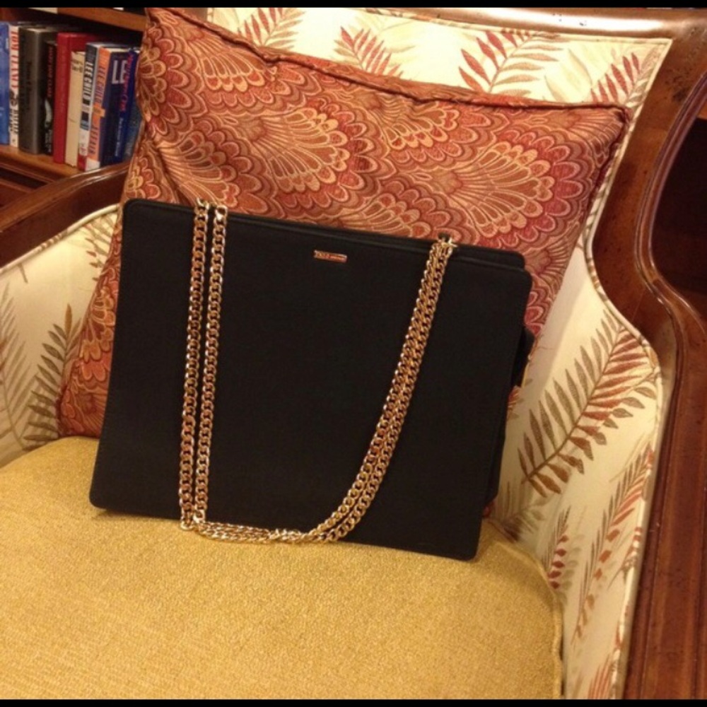 Black purse with golden chain handle