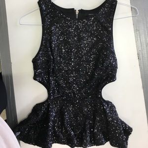 Sparkly sequined peplum top. Size Large.