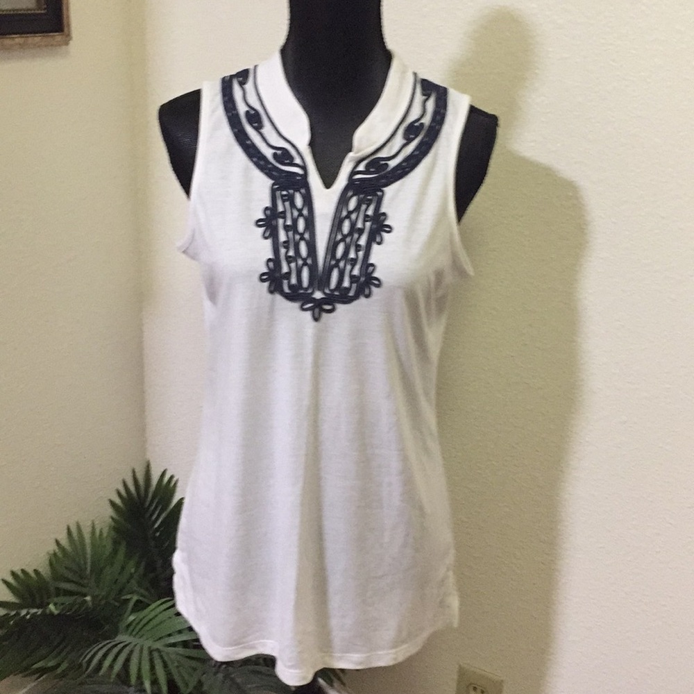 High neck sleeveless top.