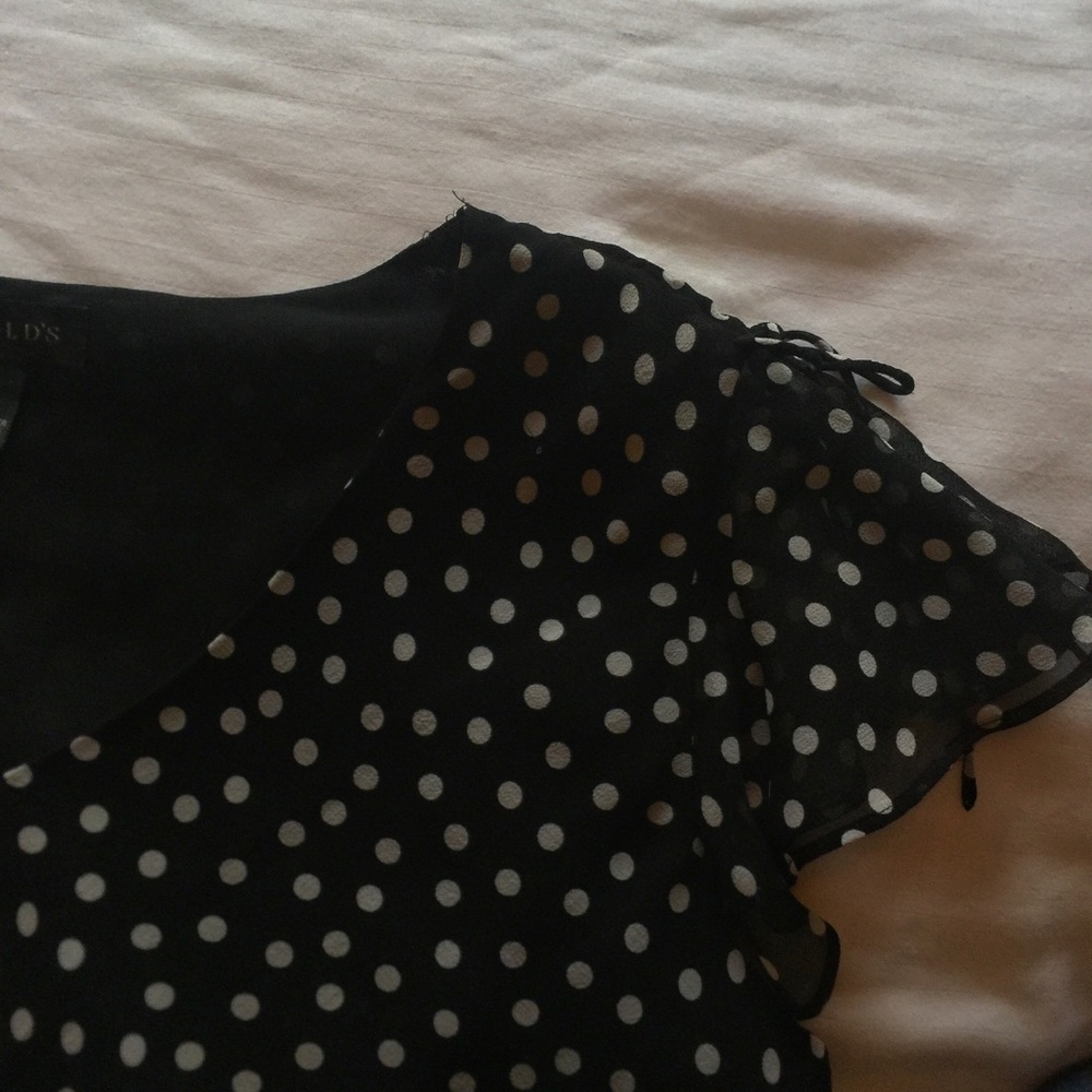 Harold's polka dot blouse.