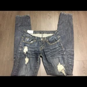 Dark denim distressed ripped jeans