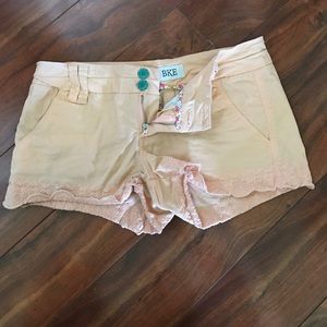 Peach, scalloped shorts