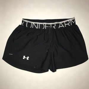 Black under armor running shorts.