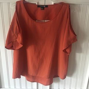 Shirt with arm cut outs