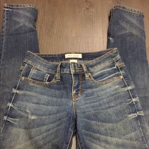 Dark wash distressed skinny denim jeans