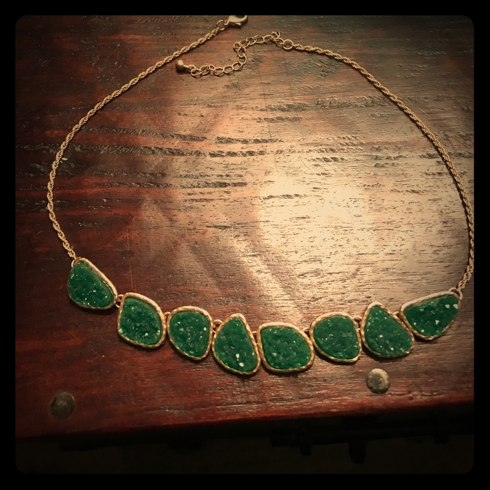 Gold necklace with green stones