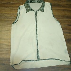 High/Low cream blouse w/snake print detail.