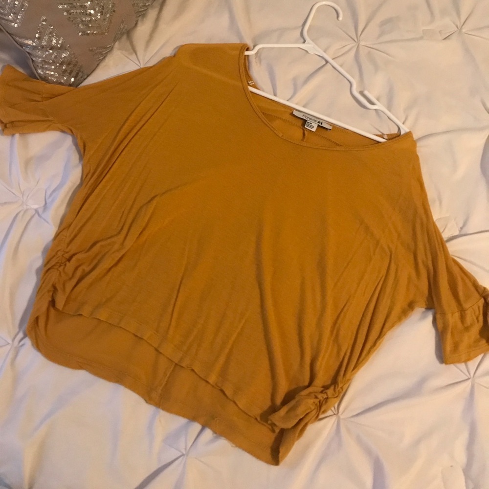 gold shirt