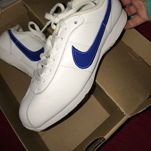 White and Blue nike shoes worn once