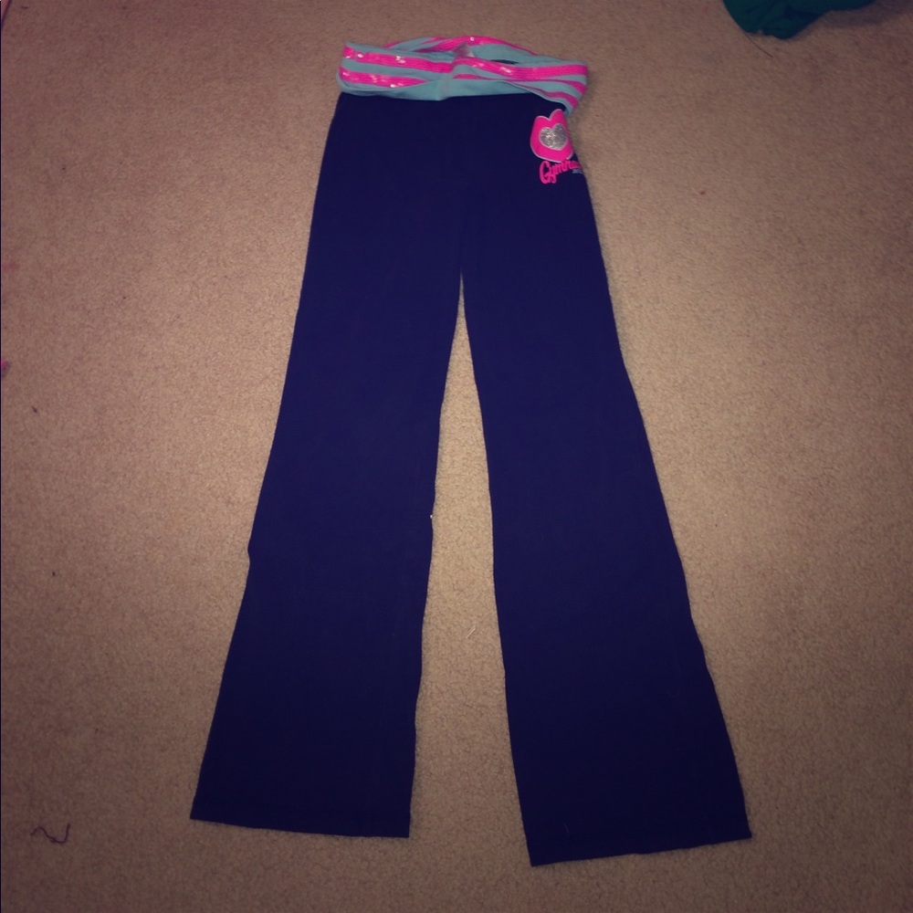 Justice yoga pants that say gymnast on them