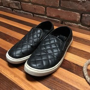 Black quilted slip on shoes