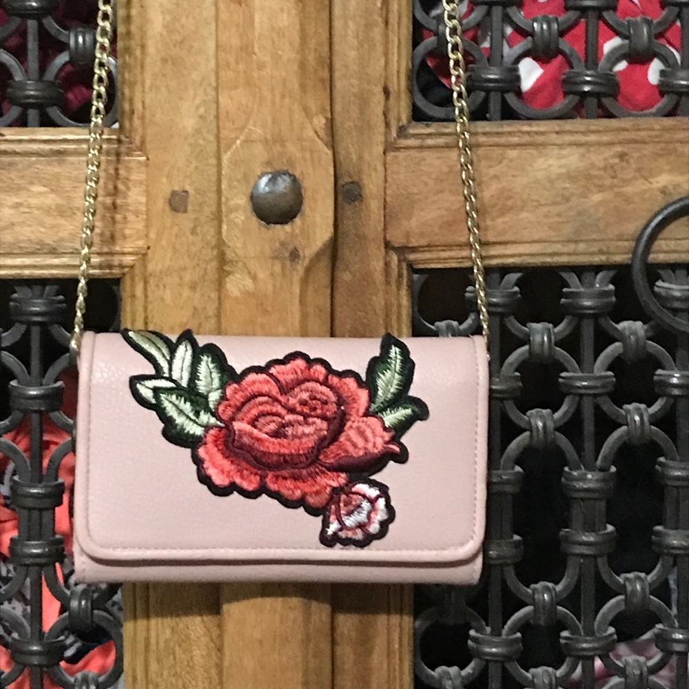 A tiny clutch baby pink purse
