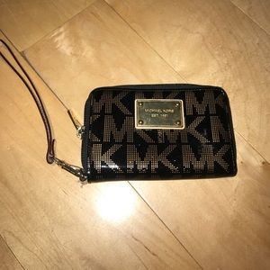 Michael Kors black and gold wristlet