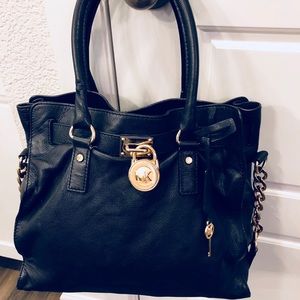 Michael Kors black purse with key and lock