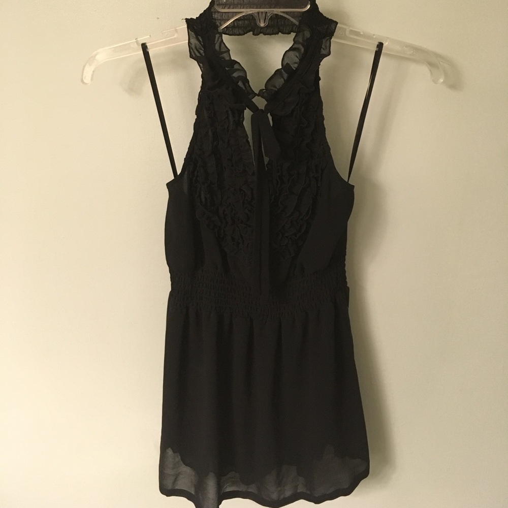 Black halter with ruffle detail at the neck