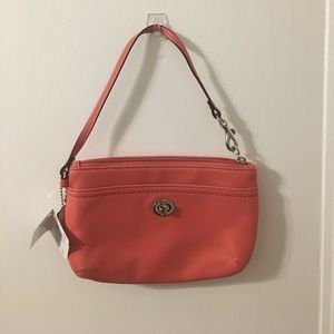 Coral Coach wristlet NWT Coral Coach wristlet NWT