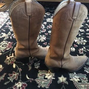 Brown leather cowboy boots.