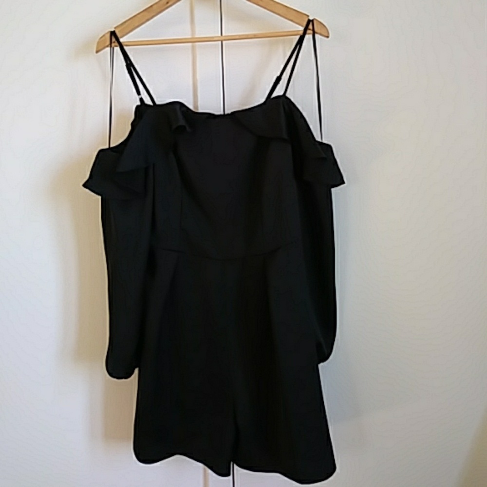 Romper with long sleeves. Zippered back.