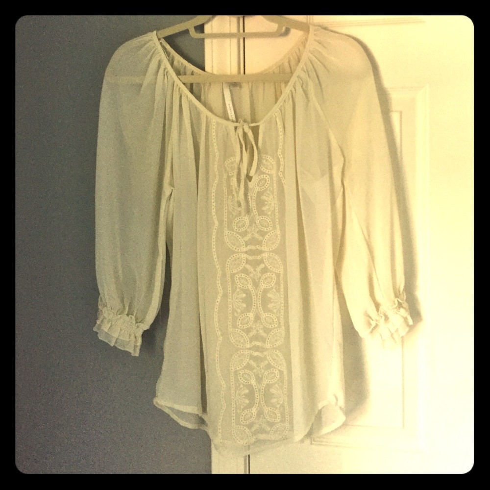 Sheer white top with filigree design