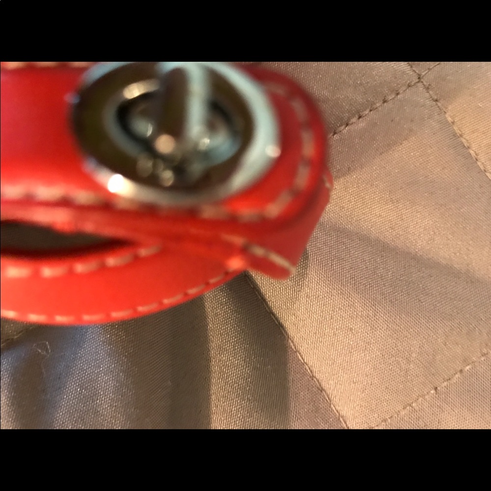 Orange Coach band bracelet.