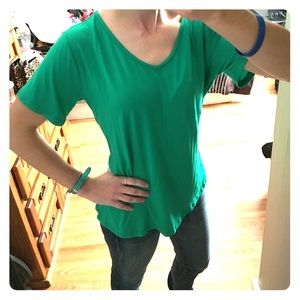 Green short sleeve shirt with cross straps