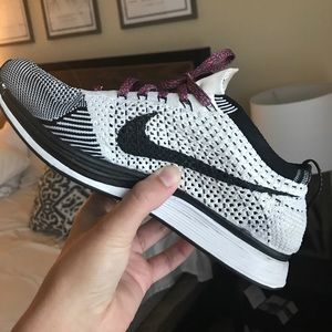 Black and white Nike fly knit racer sneakers
