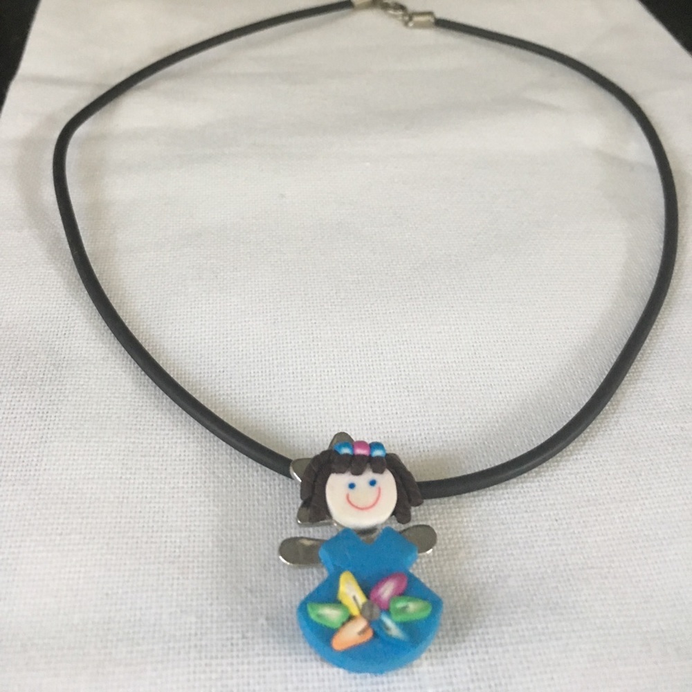 Signed copyrighted “child” Necklace on Leather