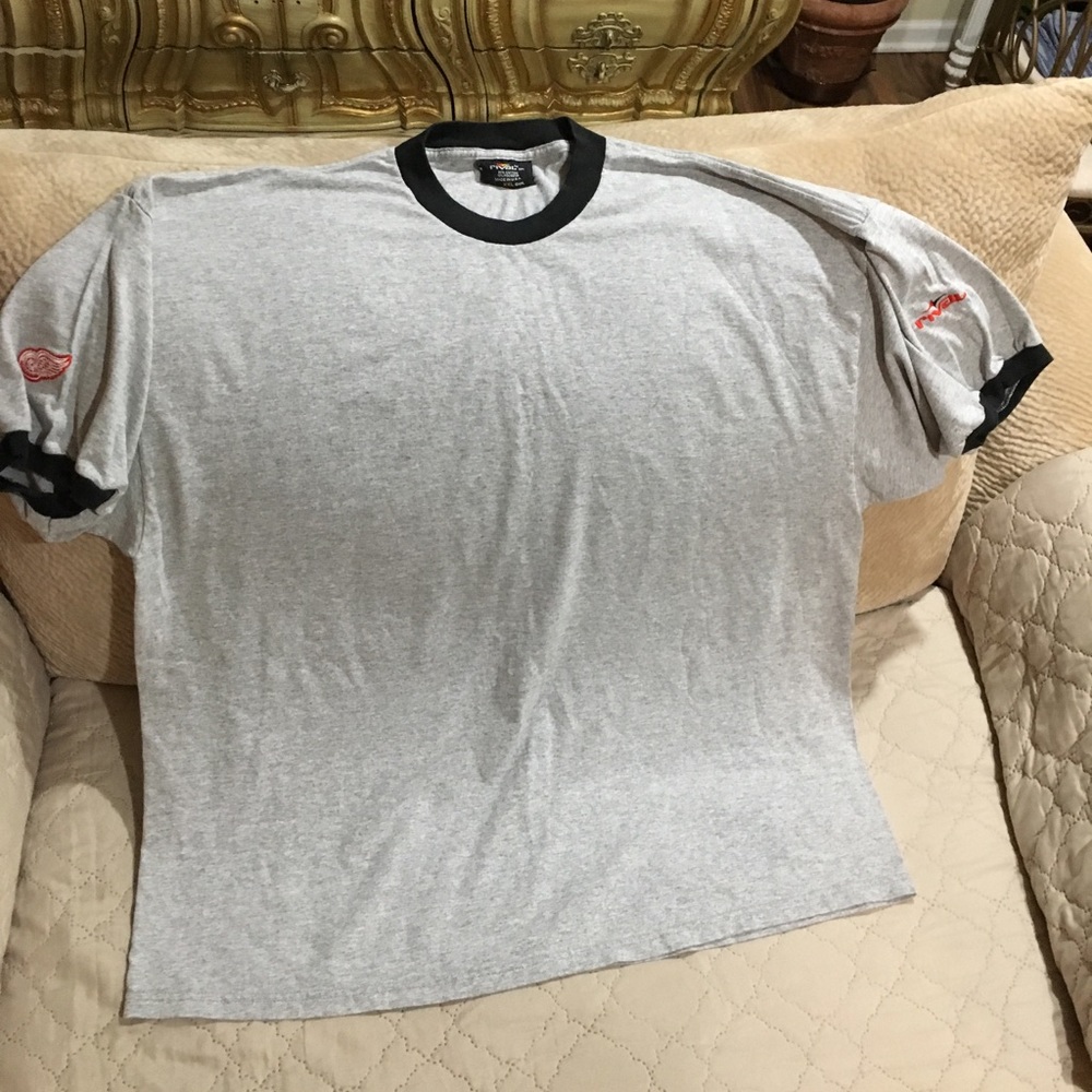 Rival New Gray w/ Red wings emblem on sleeve
