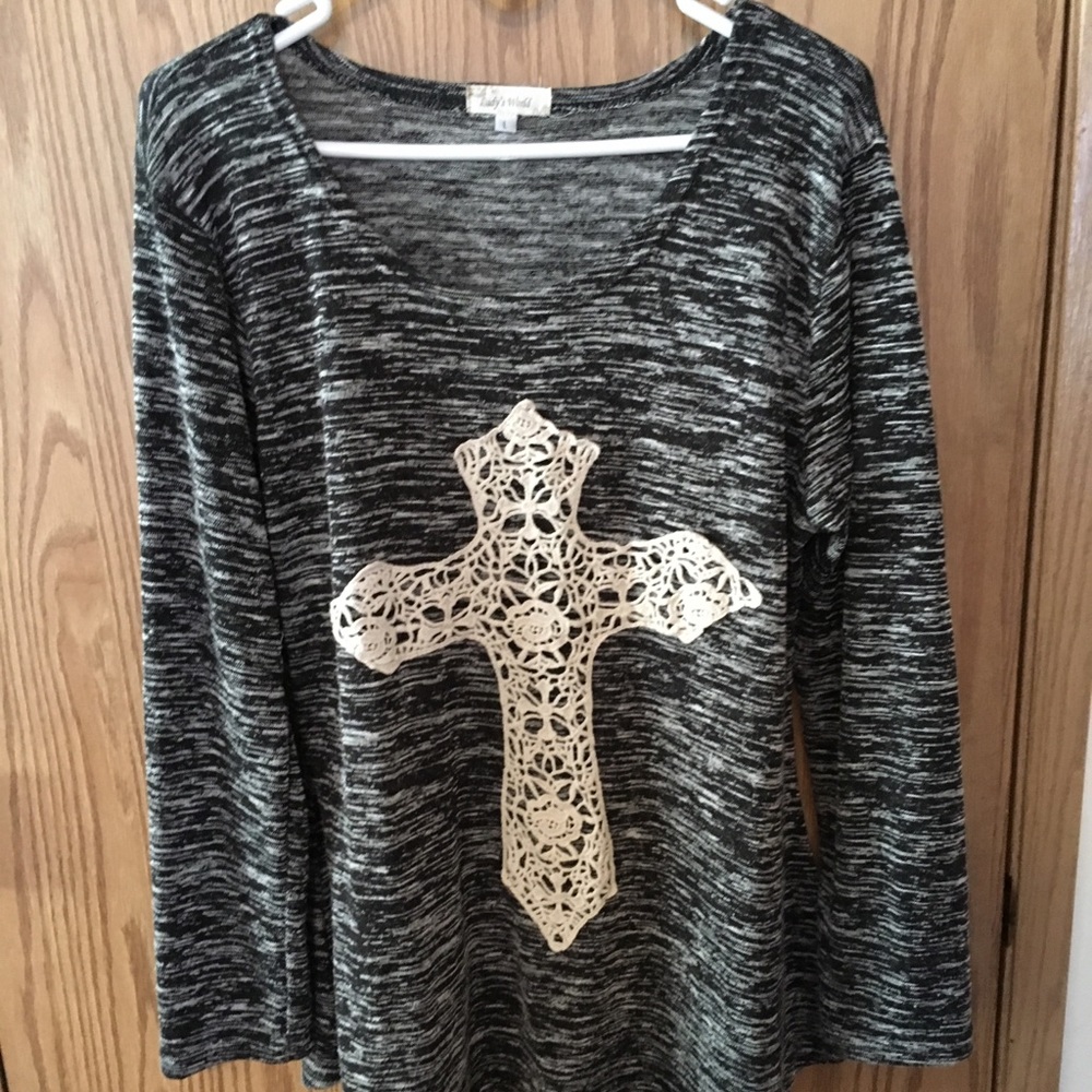 Lady’s World top beautiful crocheted cross on it.