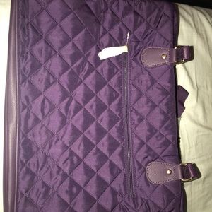 Purple weekender bag.