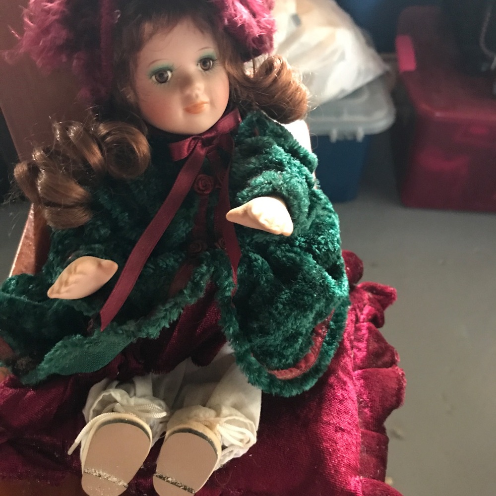 Porcelain doll winds up music maker w/ pillow
