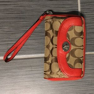 Coach wallet/wristlets with phone compartment.