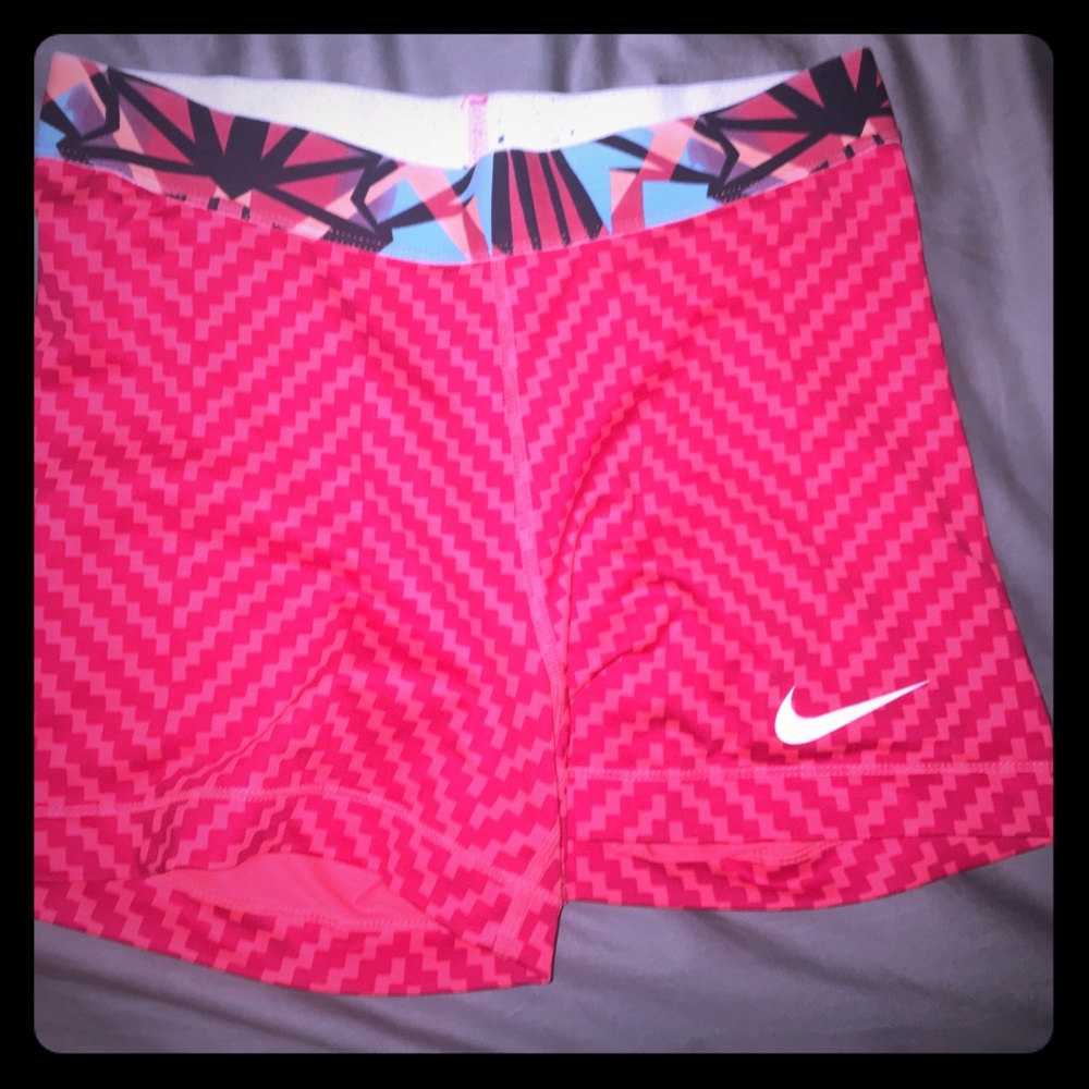 reddish orange checkered Nike Pros
