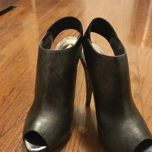 Holiday Ready with this Slingback Peep Toe Bootie.