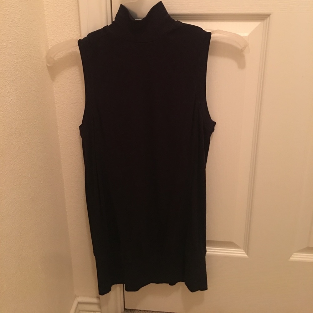 Black sleeveless turtle neck