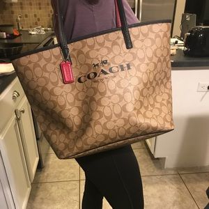 Authentic Coach bag with red handles