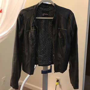 Black leather jacket. Guess.