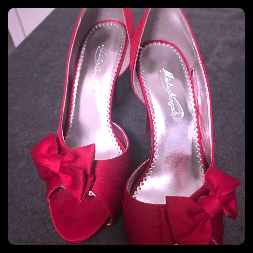 Red satin pumps