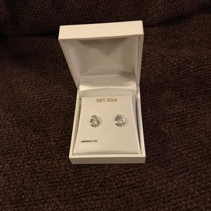 10 karat white gold earrings with diamond accent.